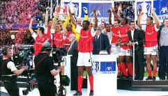 Arsenal lifting the cup in 2002